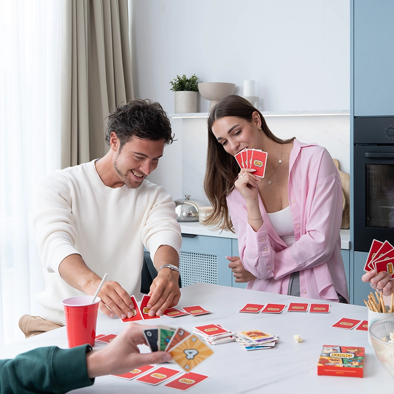 Friends playing the FOMO card game