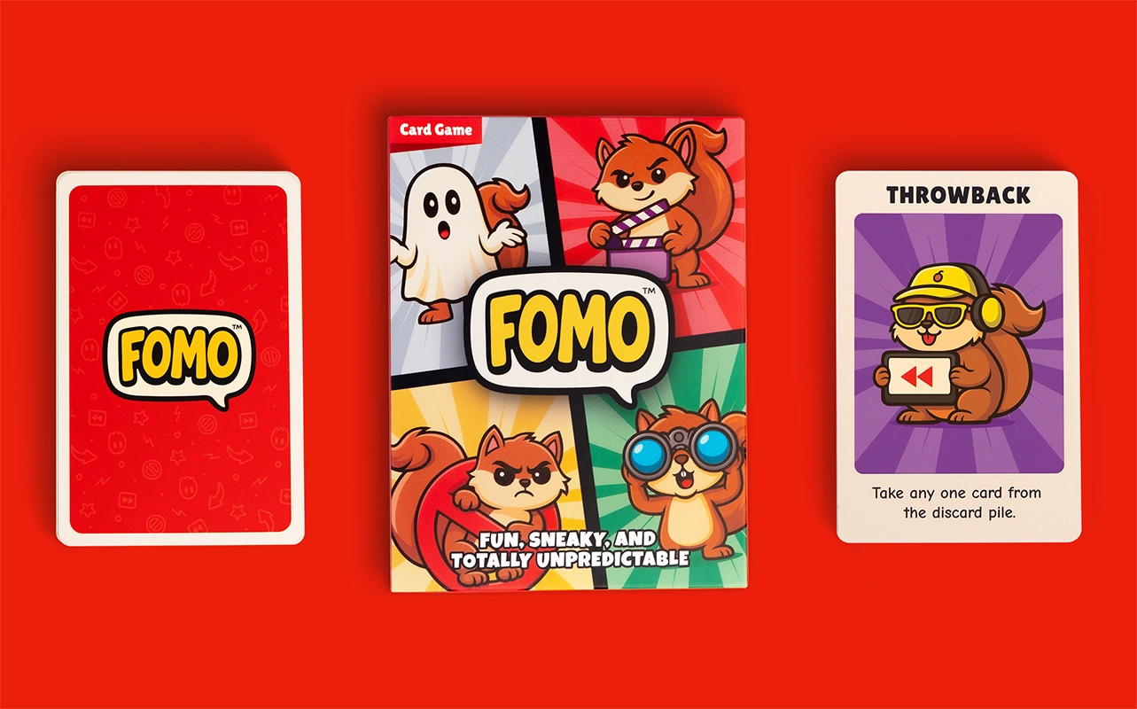FOMO Card Game - Box and Cards on table