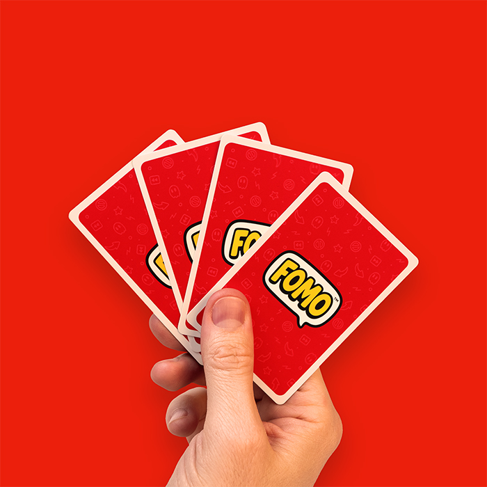 FOMO cards in hand